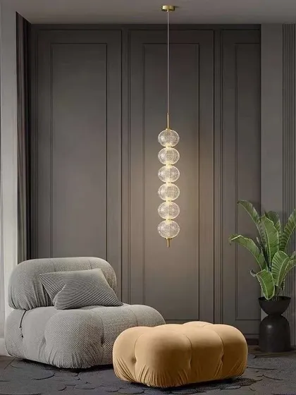 A vertical stack of clear glass globes creates this simple yet beautiful pendant. It's ideal for a corner or next to a comfortable chair.
