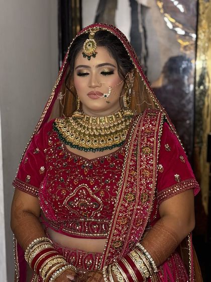 A serene, eyes-closed shot that allows a full appreciation of the eyeshadow blending and the overall softness of the bridal makeup.