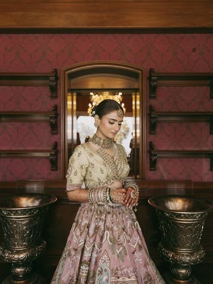 The full view of Vasav's pastel dream. Her elegant hair bun and understated makeup allowed her intricate jewelry and stunning lehenga to shine.