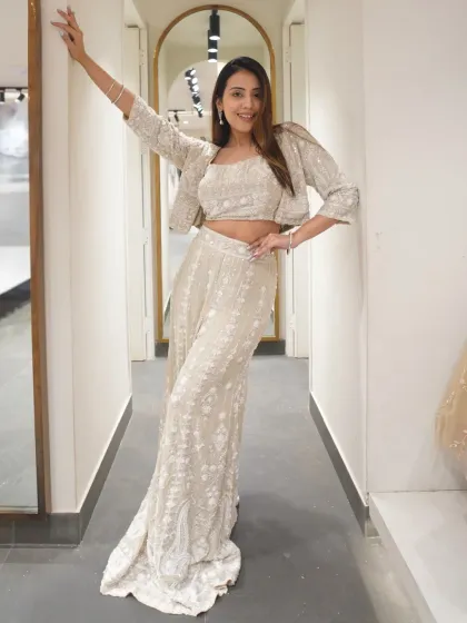 A little bit of desi, a little bit of drama. This white embroidered co-ord set with a jacket is effortlessly chic.