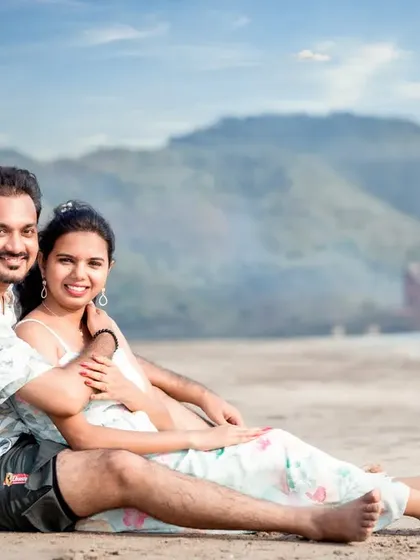 A relaxed and happy portrait of a couple enjoying their time on the sand. This kind of comfortable, smiling shot is perfect for capturing the easy-going love they share.