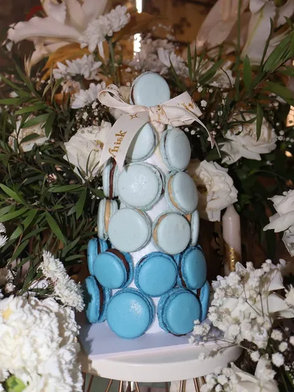 Make a statement at your next event with our stunning eggless macaron tower. This beautiful centerpiece features an ombre blue design and is perfect for dessert tables at weddings, birthdays, or corporate functions.