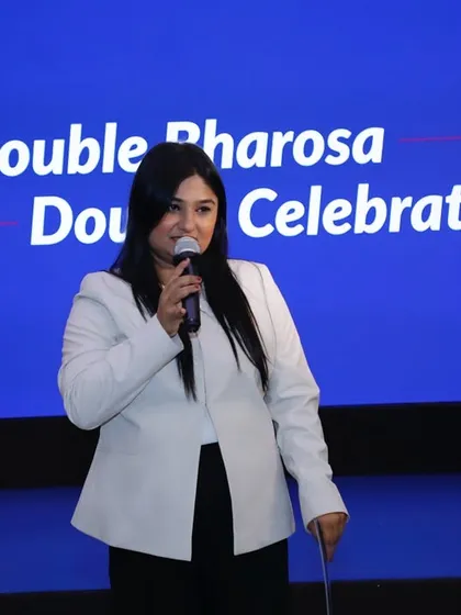 A close-up of me speaking at the Axis Max Life event, highlighting my confidence on the mic.