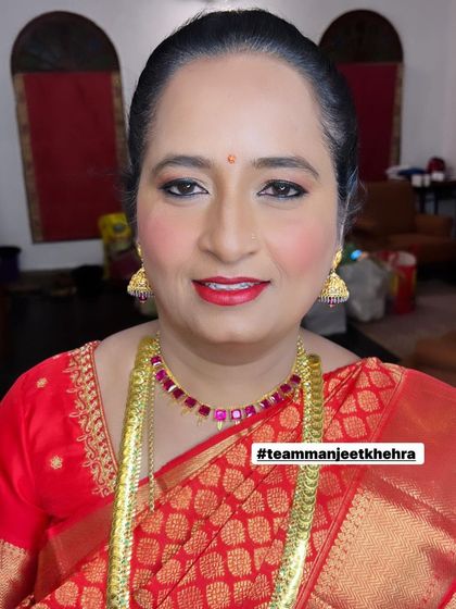 She looks radiant and proud, with makeup that enhances her natural beauty without feeling heavy.