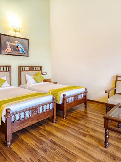 This is our twin-sharing room, perfect for friends or family embarking on a wellness journey together. The room is spacious and includes a comfortable seating area for relaxation.