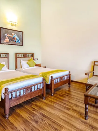 This is our twin-sharing room, perfect for friends or family embarking on a wellness journey together. The room is spacious and includes a comfortable seating area for relaxation.