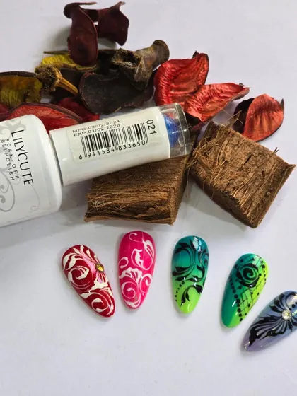 A set of vibrant nail art designs featuring intricate swirl patterns in red, pink, and green.