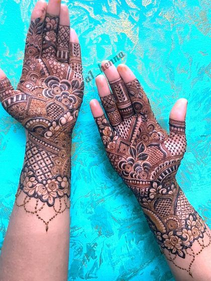 This design combines a hanging chain element with intricate floral and geometric patterns.