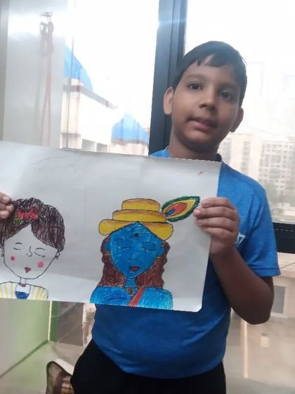 Suvodeep, a 3rd standard student, drew this portrait of Lord Krishna using oil pastels on paper. The drawing captures the iconic features like the peacock feather and blue skin tone.
