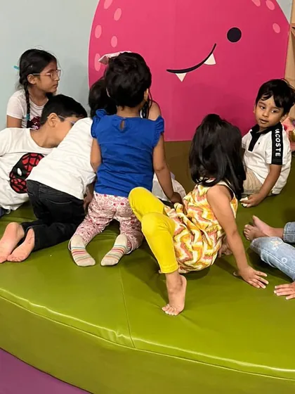 The children gather in one of our cozy corners for a story session about Ganesha. It's a time for learning, listening, and making friends.