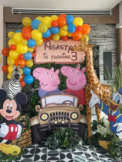 We love creating mashup themes for kids' parties. This 3rd birthday celebration brought together Peppa Pig, Mickey Mouse, and jungle animals for a fun-filled character party.