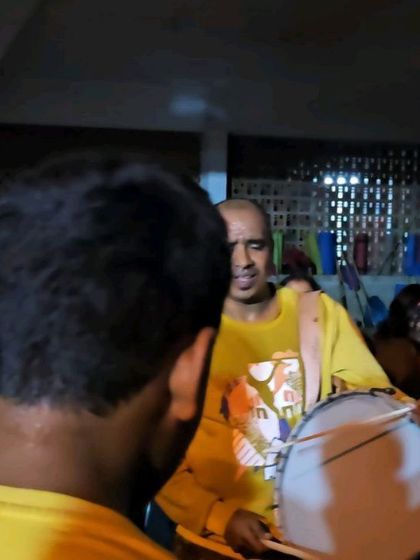 I am playing the drum, surrounded by my students. These are the moments that make us a family.