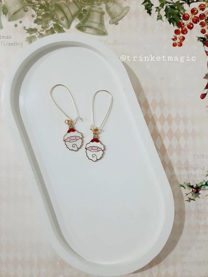 These adorable Santa face moon charm hoops are a whimsical and unique Christmas accessory.