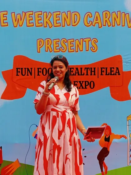 On stage at The Weekend Carnival, ready to engage the crowd. These brand expos are all about fun, food, and shopping, and I make sure the energy from the stage reflects that festive spirit.