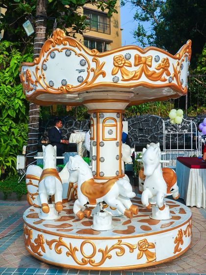 A classic white and gold carousel ride adds a touch of elegance and fun to our Disney Princess parties.