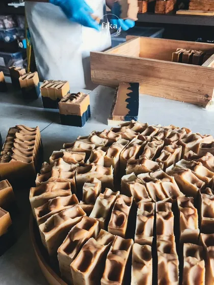 From my studio to your shelves. Here, I'm sorting through a large batch of freshly cut soaps, ensuring each one is perfect. My wholesale service is designed to be a simple, reliable way for you to enter the plant-based wellness market.