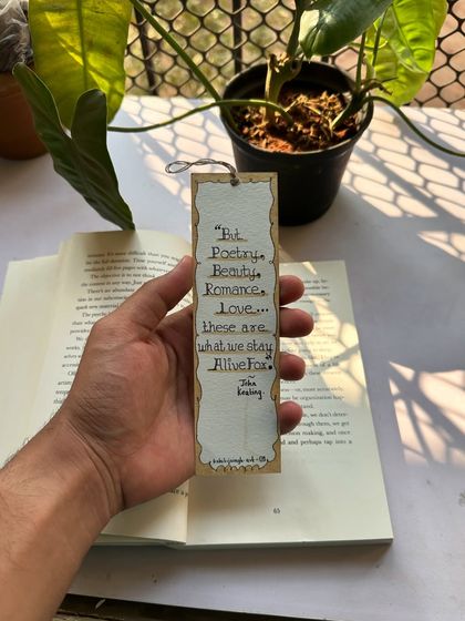 A custom bookmark I made with a quote from the movie Dead Poets Society. The lettering is done by hand, and the simple design is perfect for any book lover.