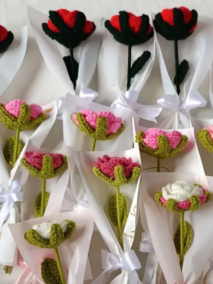 Individually wrapped open roses in various shades of pink and red.