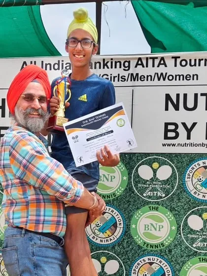 A moment of joy between father and son after Gurrshan's first U14 title win.