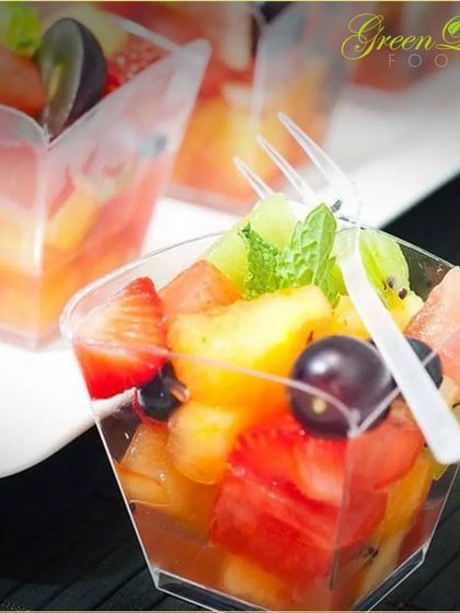 A simple cup of mixed fruit becomes a work of art with careful arrangement and a sprig of mint. This attention to detail in presentation is what sets my catering service apart.