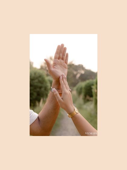 An artistic detail shot of the couple's hands, symbolizing their connection and journey together.