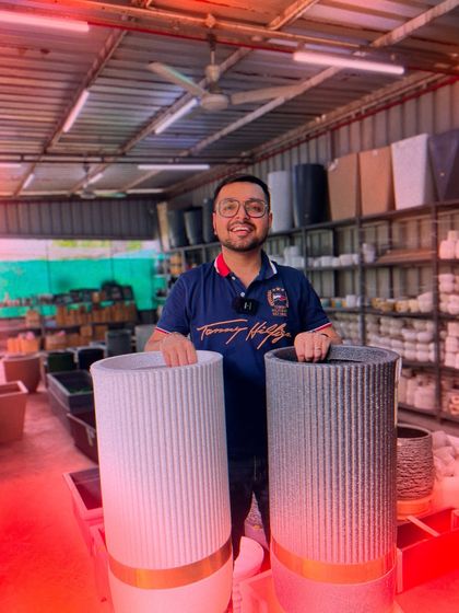 Here are two of my most popular tall roto pots with the signature gold band. The vertical ribbed design adds a touch of modern elegance, making them a favorite for home decor enthusiasts.