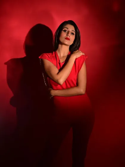 For this high-fashion shoot, I created a powerful monochromatic look with a classic red lip and sharp, clean skin. This style of editorial makeup is about making a bold statement and ensuring the model's confidence shines through.