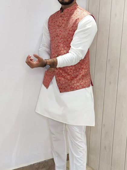 Another view of the coral floral Nehru jacket and white kurta set, highlighting the versatility of this ensemble.