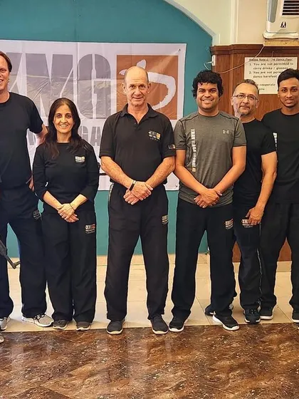 A group of our instructors after a two-day update course in Mumbai with the founder of Krav Maga, Master Eyal Yanilov. This direct training ensures the techniques we teach are authentic and effective.