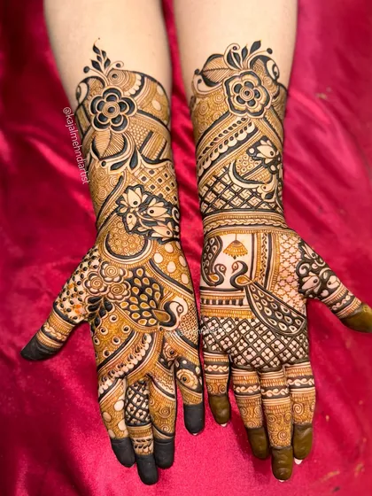 An engagement special design with bold floral work on one hand and a peacock and kalash motif on the other.