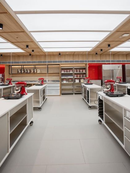 The combination of natural wood tones and stainless steel creates a modern and functional aesthetic.