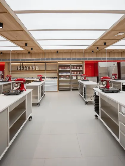 The combination of natural wood tones and stainless steel creates a modern and functional aesthetic.