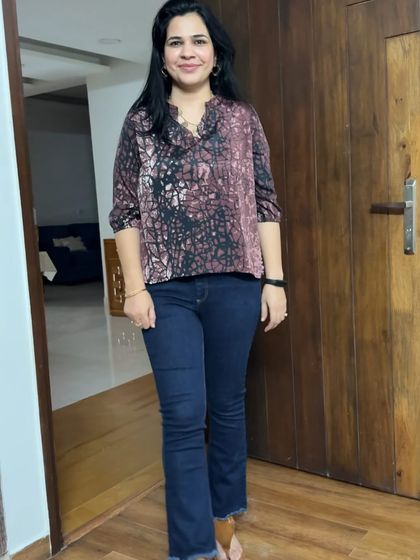 And this is the "after"! We shortened the dress from the previous image to create this stylish printed top that pairs perfectly with jeans for a casual look.