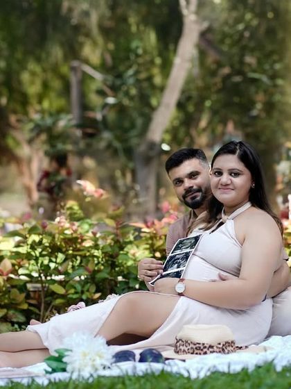 A wider shot of the park picnic setup, showing the beautiful, sunny atmosphere of an outdoor session.
