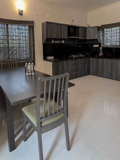 The fully equipped kitchen and dining area in one of my villas, perfect for teams staying overnight.