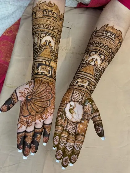 A complete view of the full-arm peacock mehndi, a testament to patience and intricate artistry.