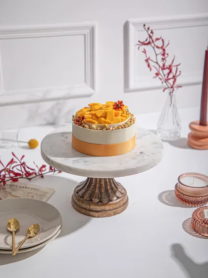 A full view of our layered mango cake, a testament to why our mango desserts are supreme.