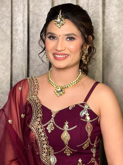 A close-up of the party makeup, showing the soft eye makeup and the beautiful maang tikka.