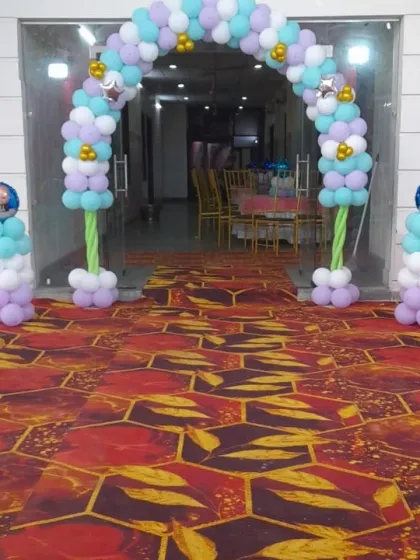 The entrance to the naming ceremony, decorated with a beautiful pastel balloon arch.