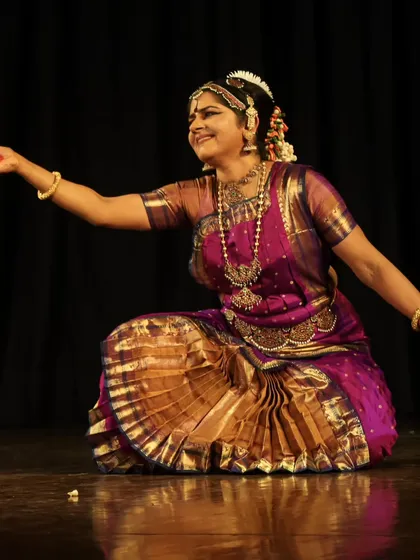 An expressive moment on stage, reaching out to the audience. The goal of every performance is to forge a deep connection and take the audience on a journey through storytelling.