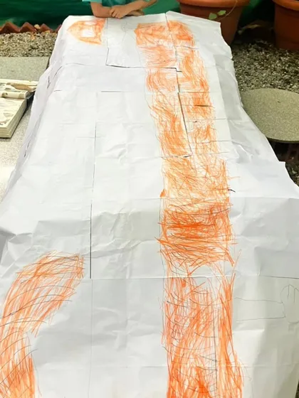 More scenes of mathematics in action, from children measuring themselves against a chalkboard to creating secret rooms of math puzzles. These images show how math is a joyful, creative, and collaborative language at our school.