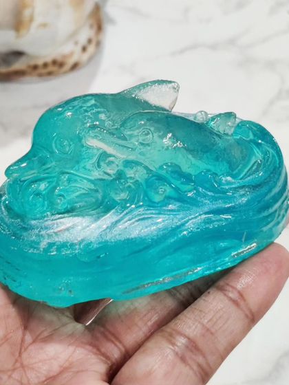 A crystal-clear dolphin soap, capturing the motion of the ocean. These designs are a fun activity to do with kids since we are re-melting a pre-made, gentle soap base.