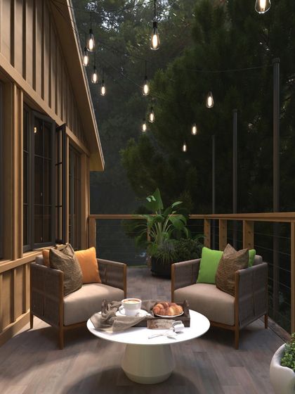 As morning light filters through the trees, this serene balcony becomes a tribute to freedom. The earthy wood tones and cushions in saffron, white, and green echo the colors of our flag, creating a space for quiet celebration.