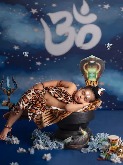 A peaceful little Shiva sleeps soundly on a shivling, a picture of divine innocence.