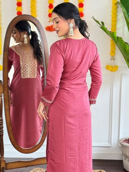 This dusty pink viscose chanderi kurta is soft and romantic. The heavy thread and sequin work give it a dressy feel without being over the top.