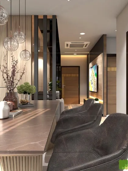 A close-up of a dining or breakfast bar setup. The combination of wood paneling, dark leather chairs, and pendant lighting creates a warm and inviting space.