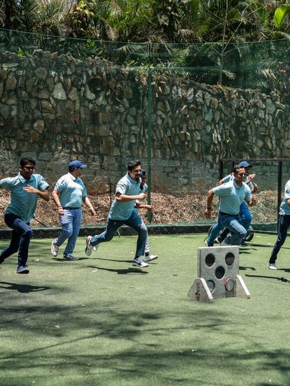 The race is on. Team members sprint towards the target in a fast-paced activity that gets everyone's energy up.