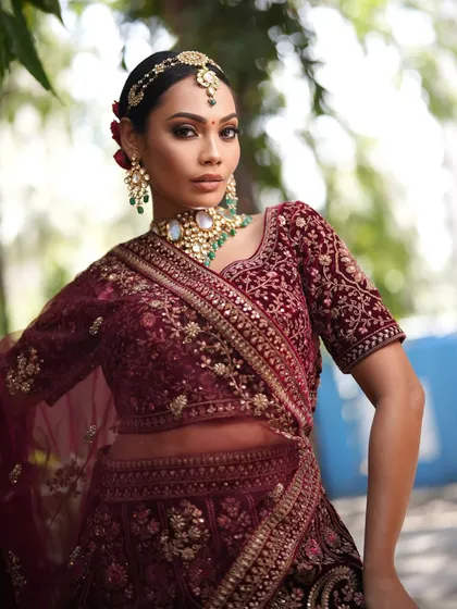 A full-body shot that captures the grandeur of the entire bridal look.
