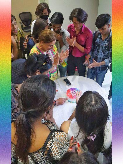 A Pride cake cutting ceremony with our community members. Celebrating these moments together is what makes our work so special.