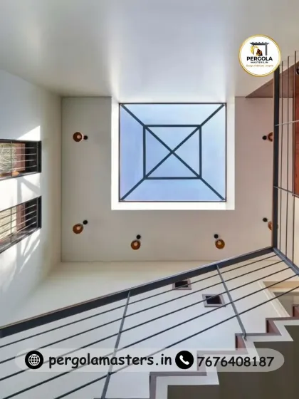 A look from below at one of our minimalist skylight designs. Installed at the top of a staircase, this square pyramid skylight floods the multi-level space with natural light, reducing the need for artificial lighting and creating a sense of openness and height.